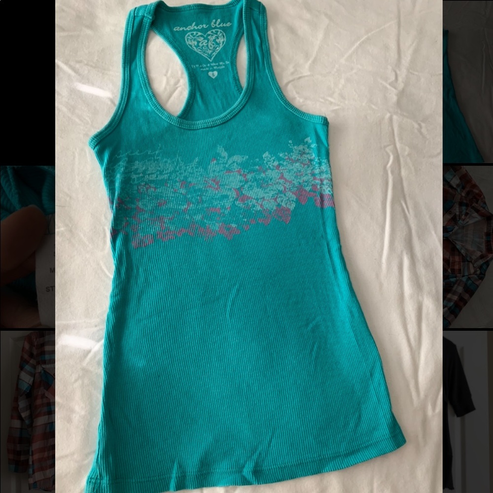 Turquoise tank top with hibiscus design. Size S.